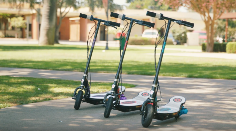 Three E90 Razor scooters lined up in a row