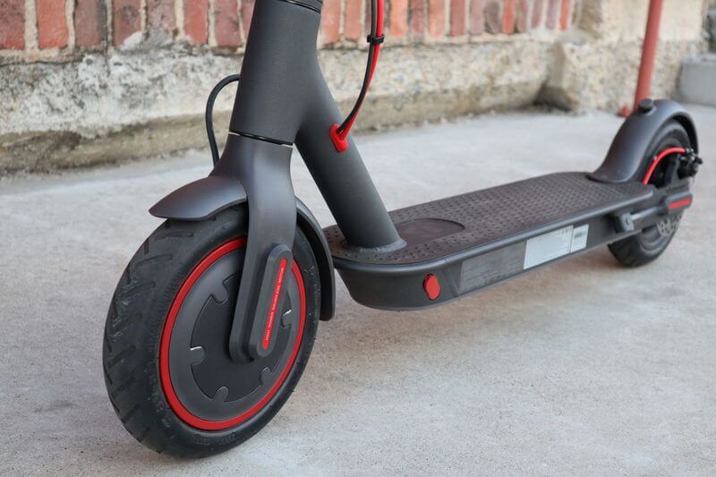 Xiaomi specs with matte grey with red wheel trim and deck