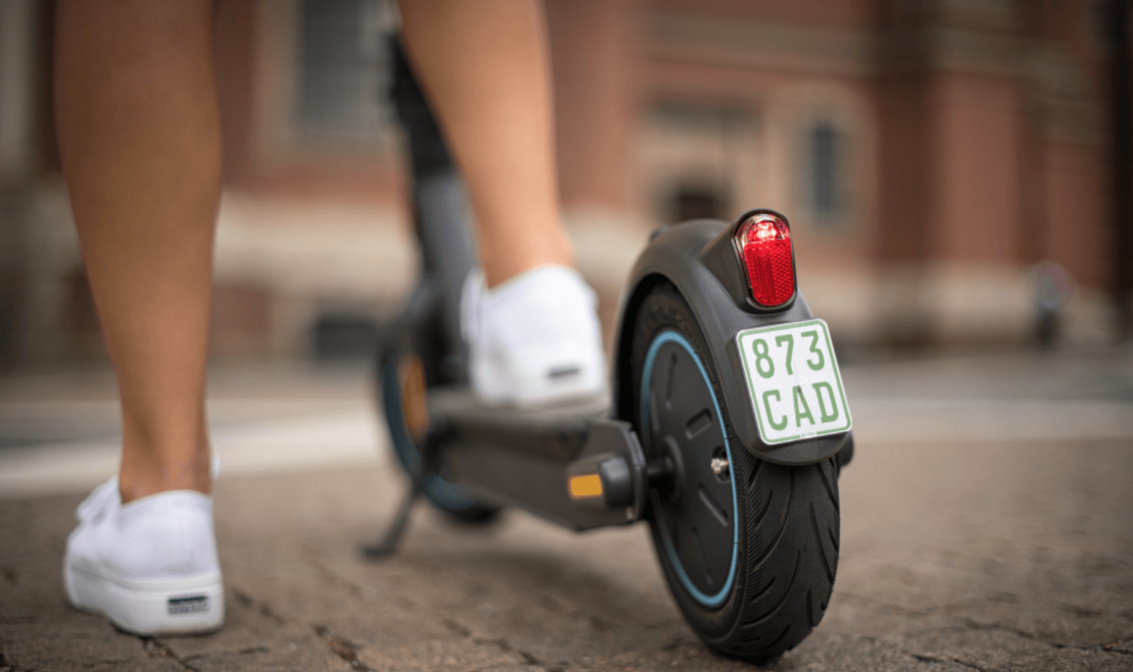 Woman standing on the desk of a G30 max from Segway